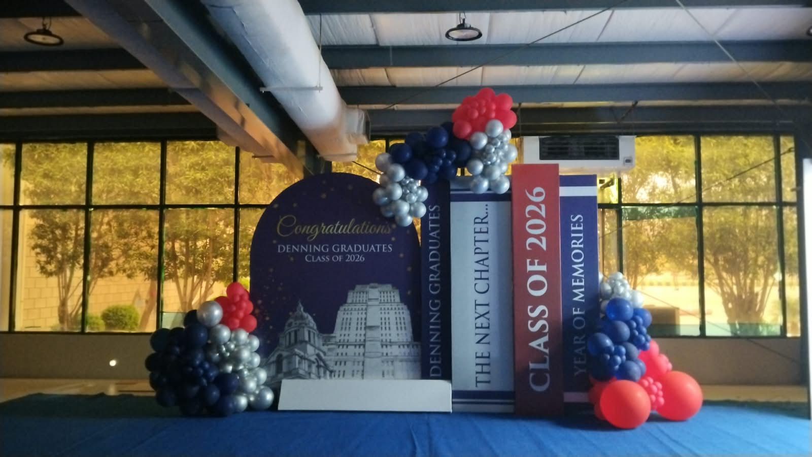 Congratulations backdrop and branded display stand for the Denning 5th Graduation Ceremony, Class of 2026, set up at Expo Centre Karachi